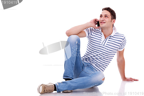 Image of young casual man talking on the phone