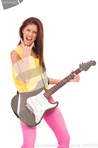 Image of passionate young woman guitarist playing