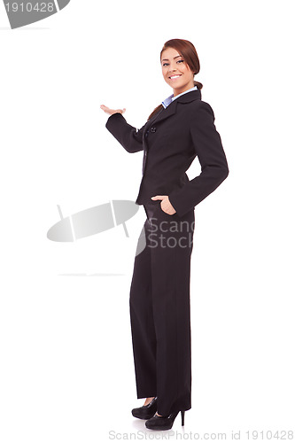 Image of young business woman presenting something