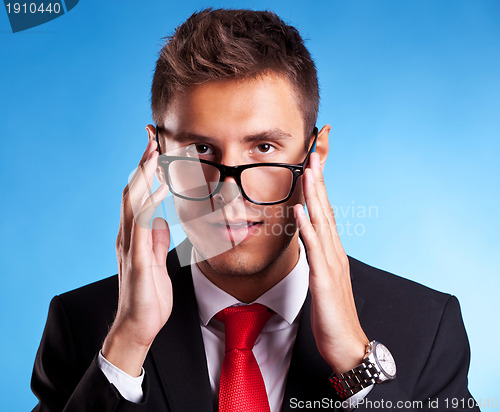 Image of young business man with a nerd glasses