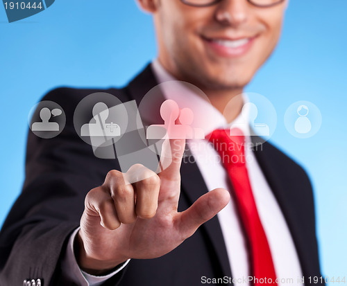 Image of Business man pressing round social buttons