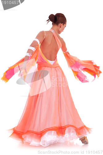 Image of  woman dancer dressed in a beautiful long orange dress