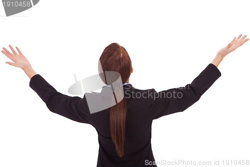 Image of back of a business woman holding her hands up