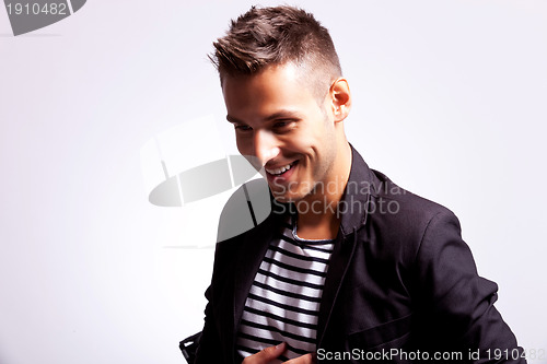 Image of young fashion casual man laughing