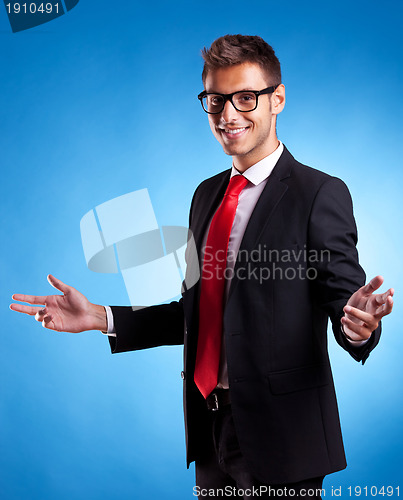Image of Smiling business man welcoming