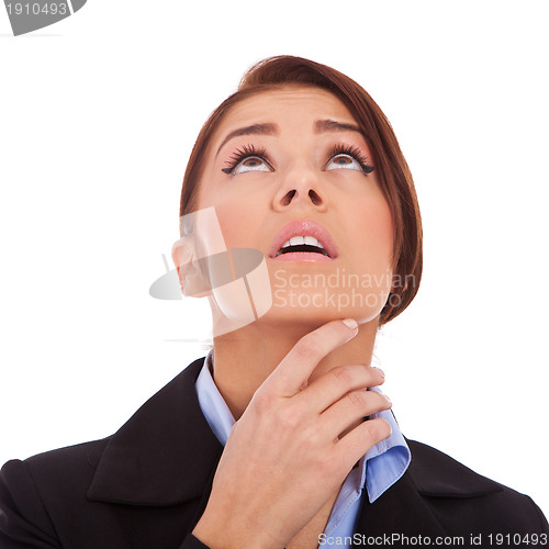 Image of beautiful young business woman, looking up. 