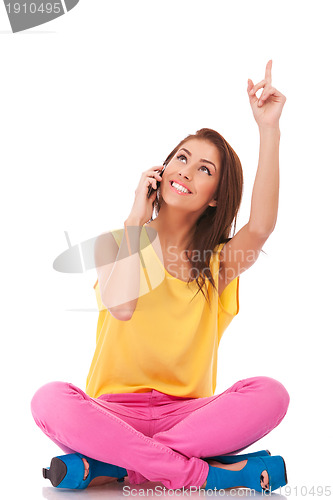 Image of talking on phone and pointing up