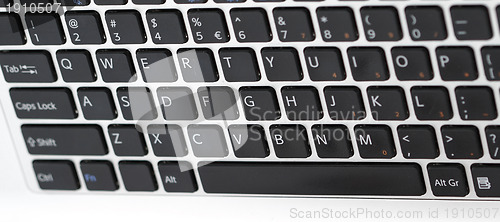 Image of Young woman working on laptop