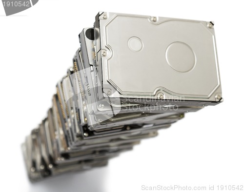 Image of high stack of used hard drives