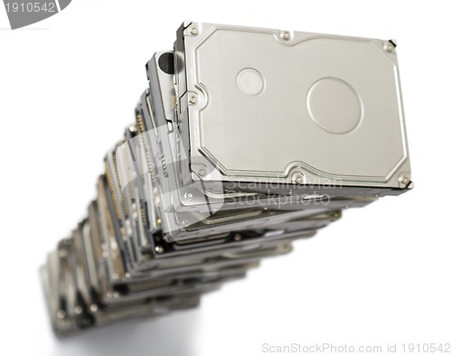 Image of high stack of used hard drives