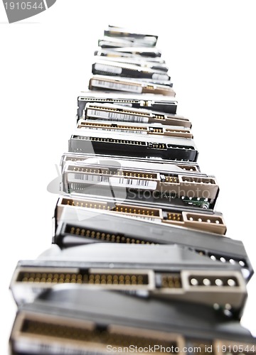 Image of high stack of used hard drives