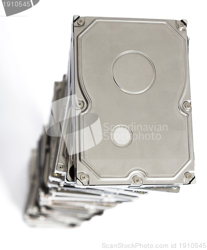 Image of high stack of used hard drives