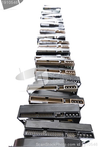 Image of high stack of used hard drives