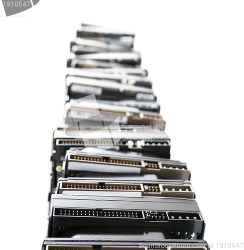 Image of high stack of used hard drives