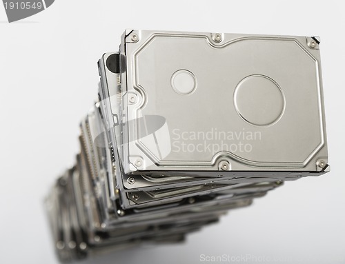 Image of high stack of used hard drives