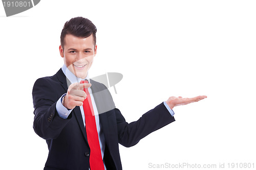 Image of business man showing and pointing 