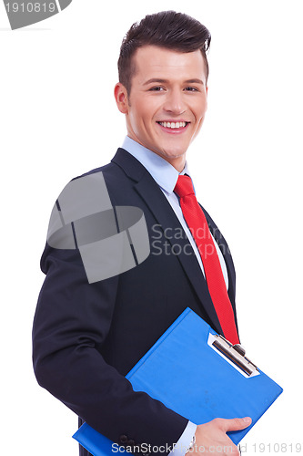 Image of businessman holding blank clipboard