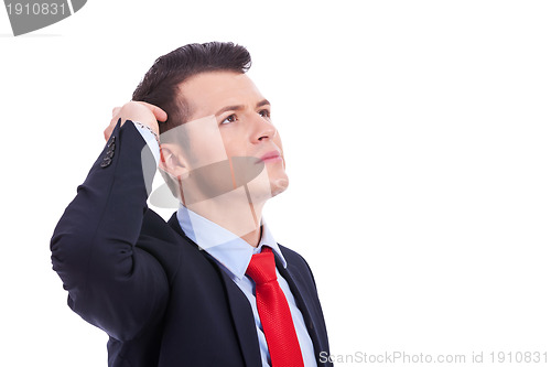 Image of handsome young thoughtful business man 