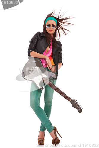 Image of relaxed rock and roll babe with windy hair