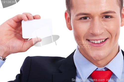 Image of Business man showing a blank business card