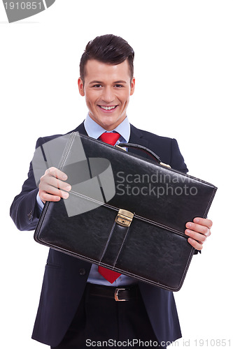 Image of business man giving his briefcase 