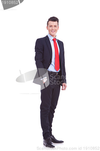 Image of business man standing with hand in pocket 