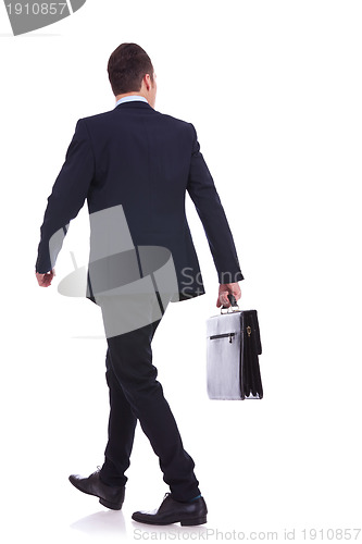 Image of back of a walking business man holding a briefcase 