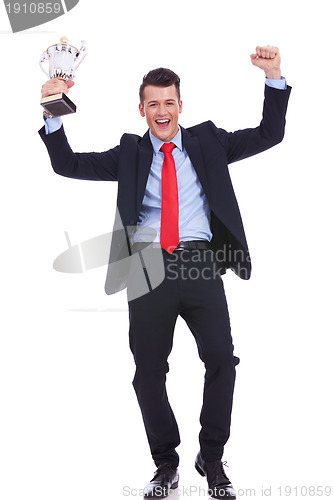 Image of business man holding a gold trophy