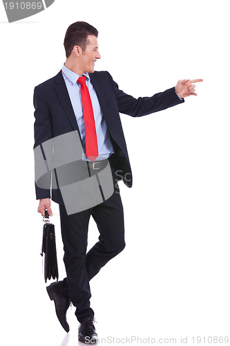 Image of business man pointing to his side