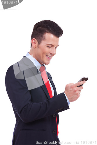 Image of business man reading an SMS on cellphone