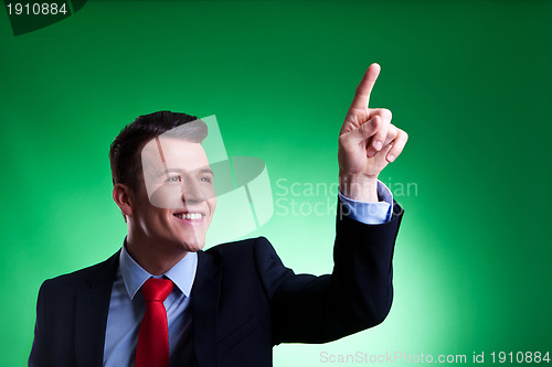 Image of business man pushing imaginary digital buttons