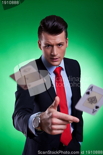 Image of young business man throwing the winning hand 