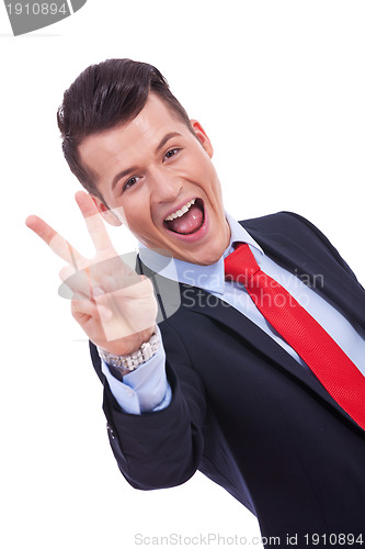 Image of victory gesturing business man
