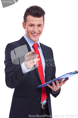 Image of Casual Business man With a Clipboard pointing