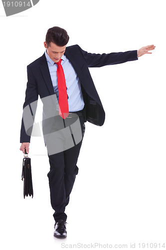 Image of Business man with slow walking with fear from falling