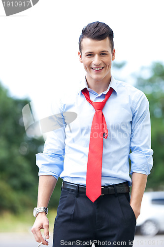 Image of business man having a break and smoking