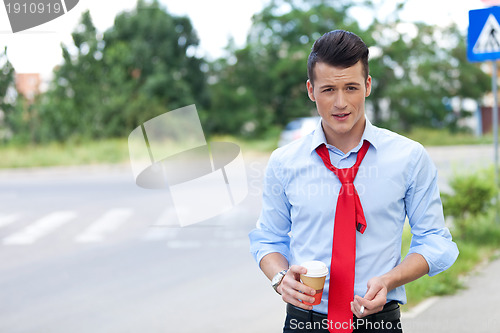 Image of young business man having a break