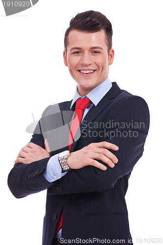 Image of business man standing with crossed arms