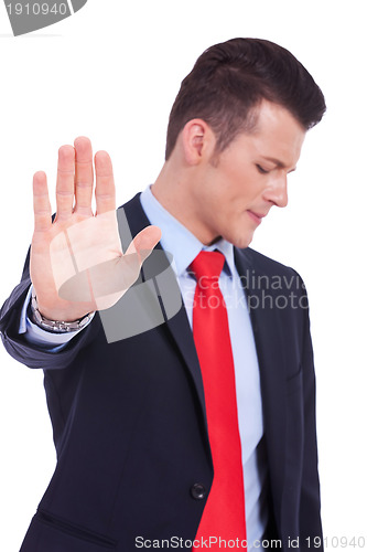 Image of Business man showing stop gesture 