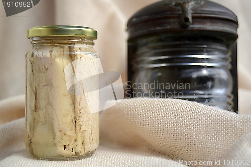 Image of tuna glass jar and maritime motifs