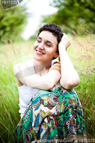 Image of cute girl on fresh grass 