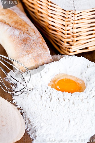 Image of  bread, flour, eggs and kitchen utensil