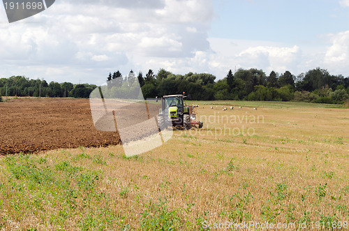 Image of tractor plow autumn field stork 