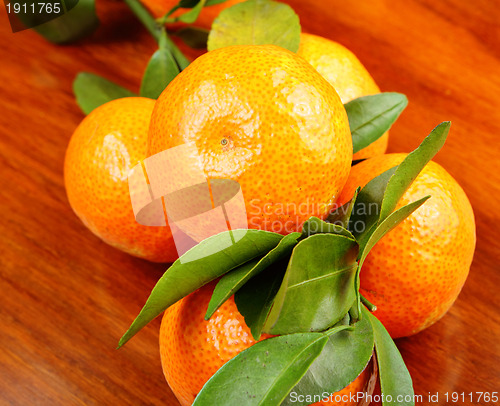 Image of mandarin on wooden background