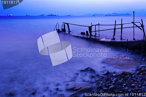 Image of pier with sunset