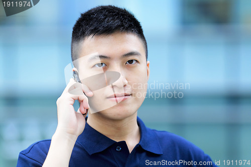 Image of asian man with cell phone