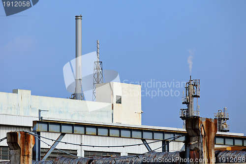 Image of Industrial landscape with factory chimney