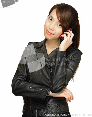 Image of asian young woman talking on phone