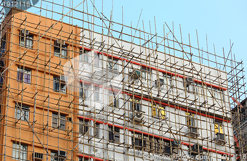 Image of bamboo scaffolding of repairing old building