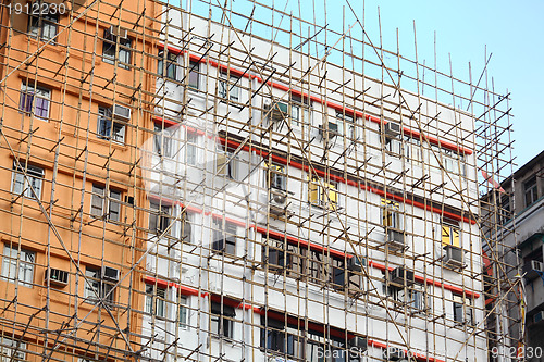 Image of bamboo scaffolding of repairing old building